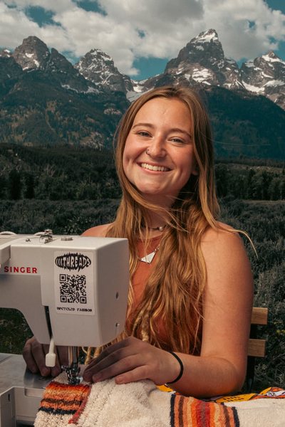 Acadia Herbst, 24, by her sewing machine