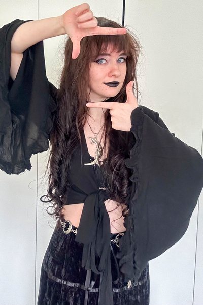 Jade Taylor in a black secondhand gothic style outfit