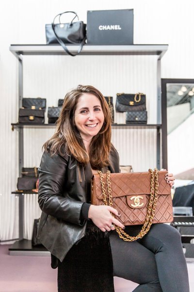 Founder of Classic Coco vintage Chanel online resale store Alexandra Steinberg holding a classic brown Chanel jumbo flap bag