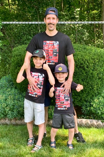 James Applegath, founder of the t-shirt site Defunkd, and his two sons in similar vintage t-shirts