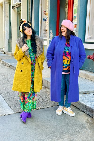 Aimée Siegel and Marisa DiSalvatore in colorful vintage outfits, photographed in the street in Philadelphia