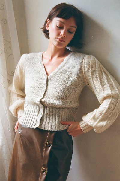 a woman wearing a Vintage Silk Angora Puffed Sleeve Knit Cardigan