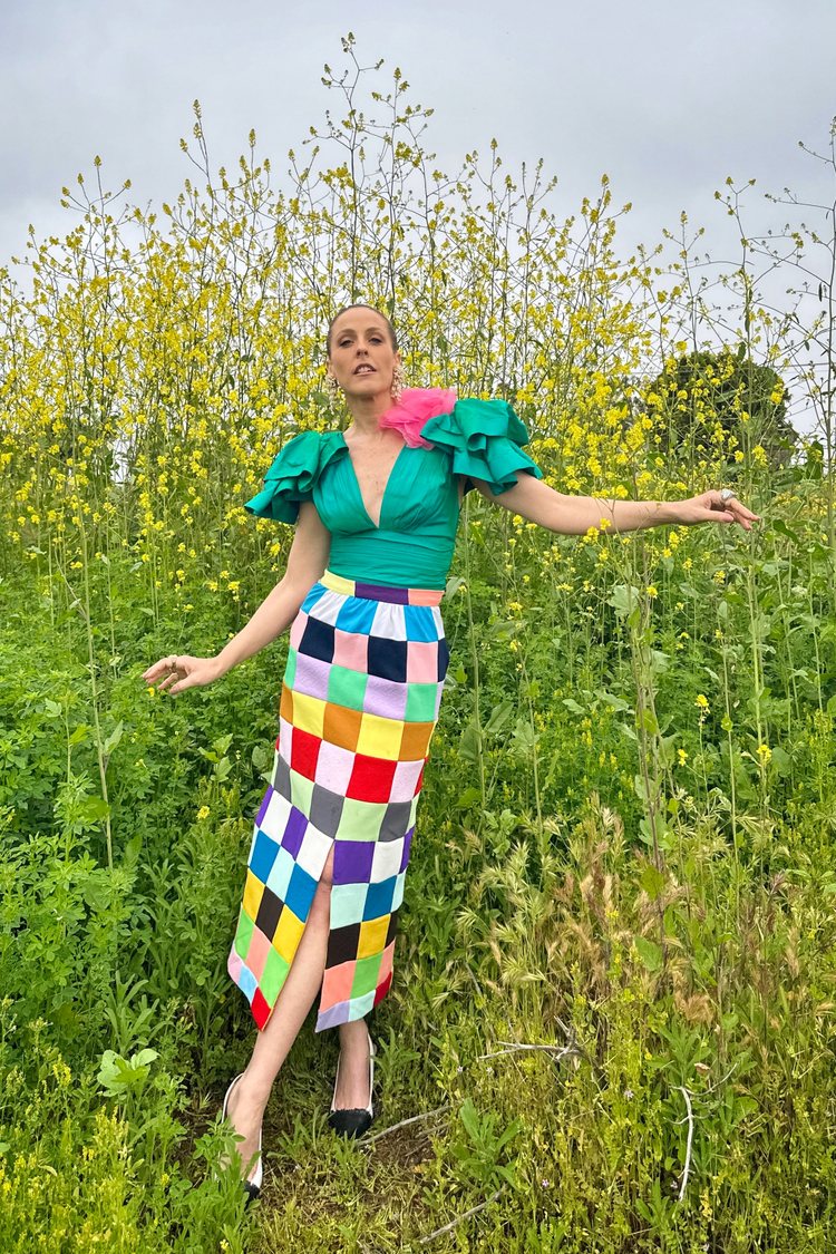 Beth from B Jones Style in a colorful vintage maxi checkerboard skirt and a teal colored statement top