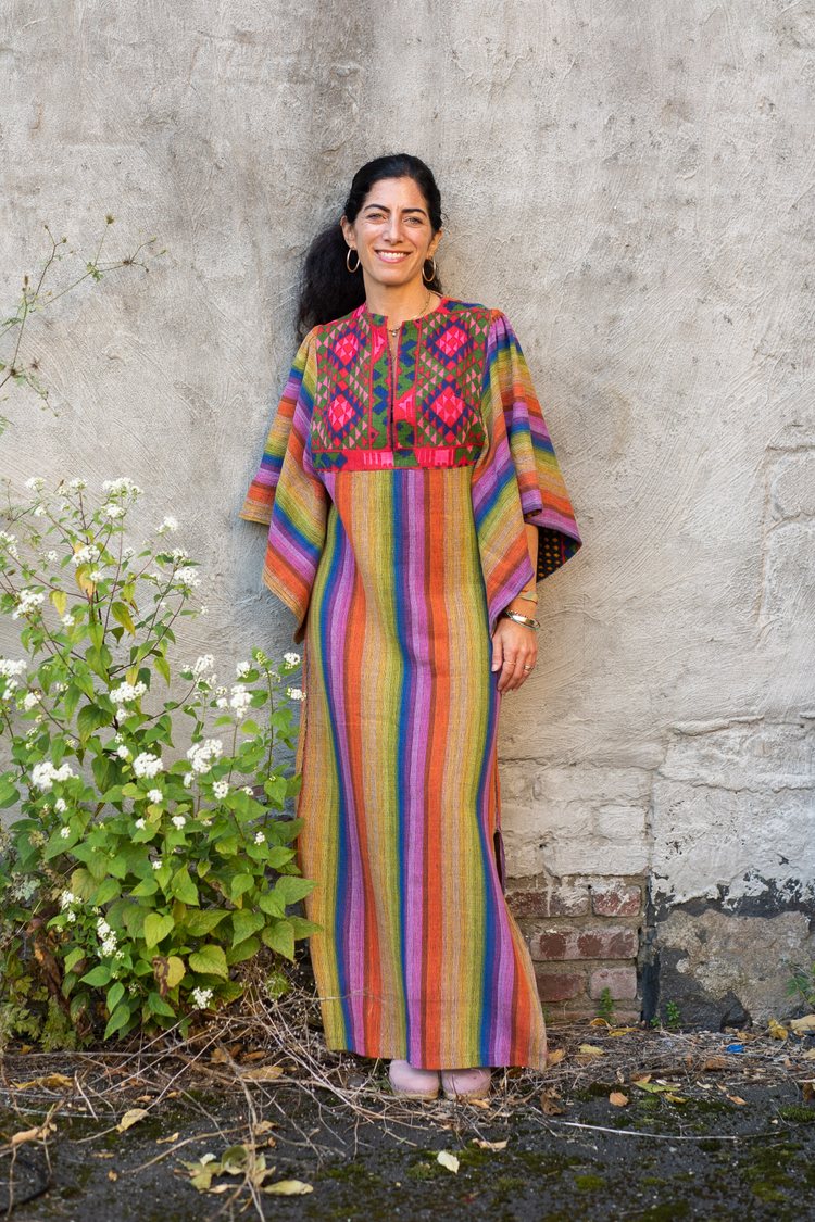 founder of the Manhattan Vintage show, Amy Abrams, wearing a colorful vintage caftan by Rikma Israel