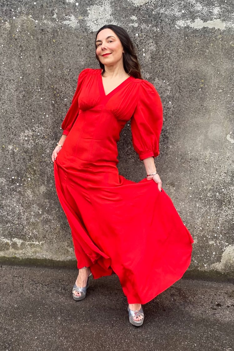 Emily Bothwell of The Archive London in a bright red vintage Ossie Clark for Quorum gown
