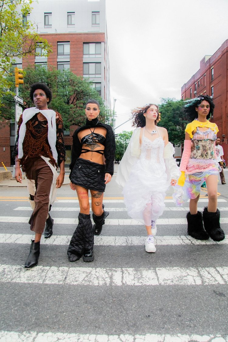 four models wearing upcycled designs by Cloud Jobi 