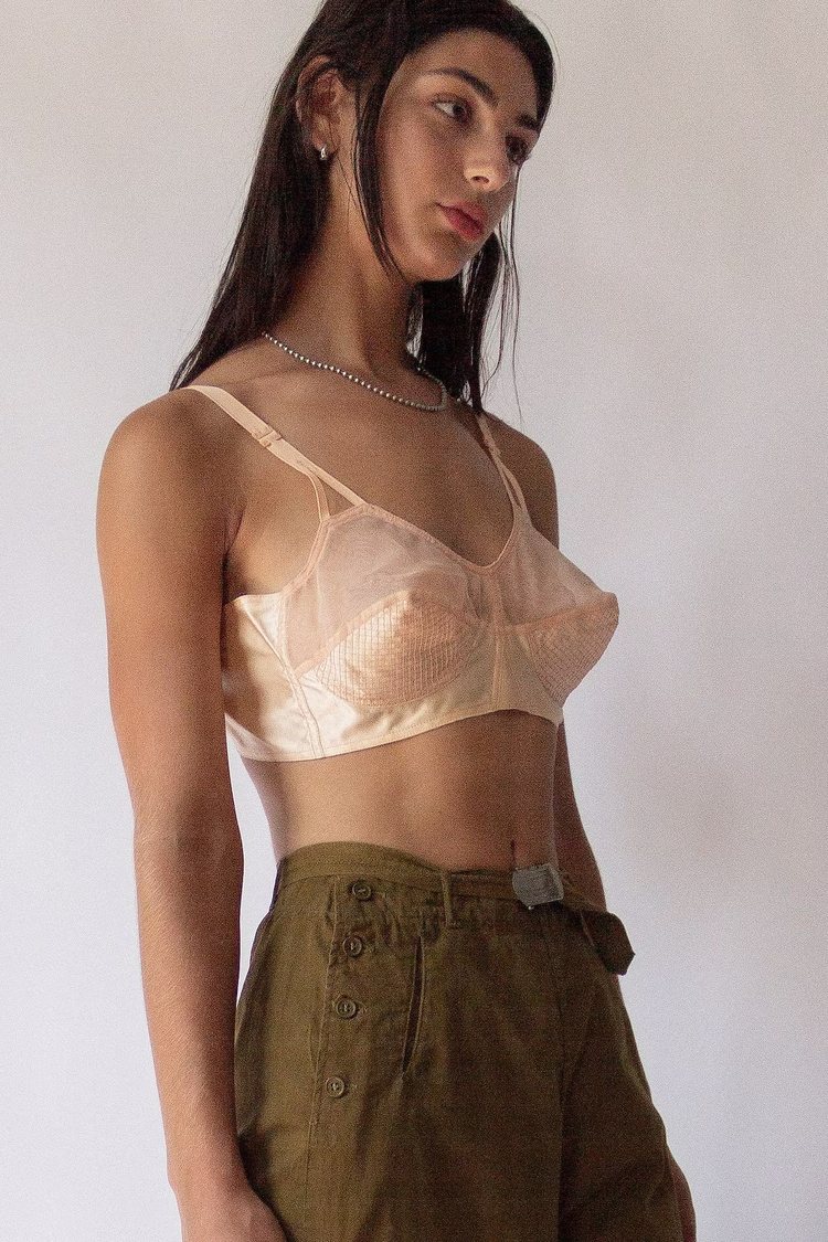 a model wearing a 30s bullet bra